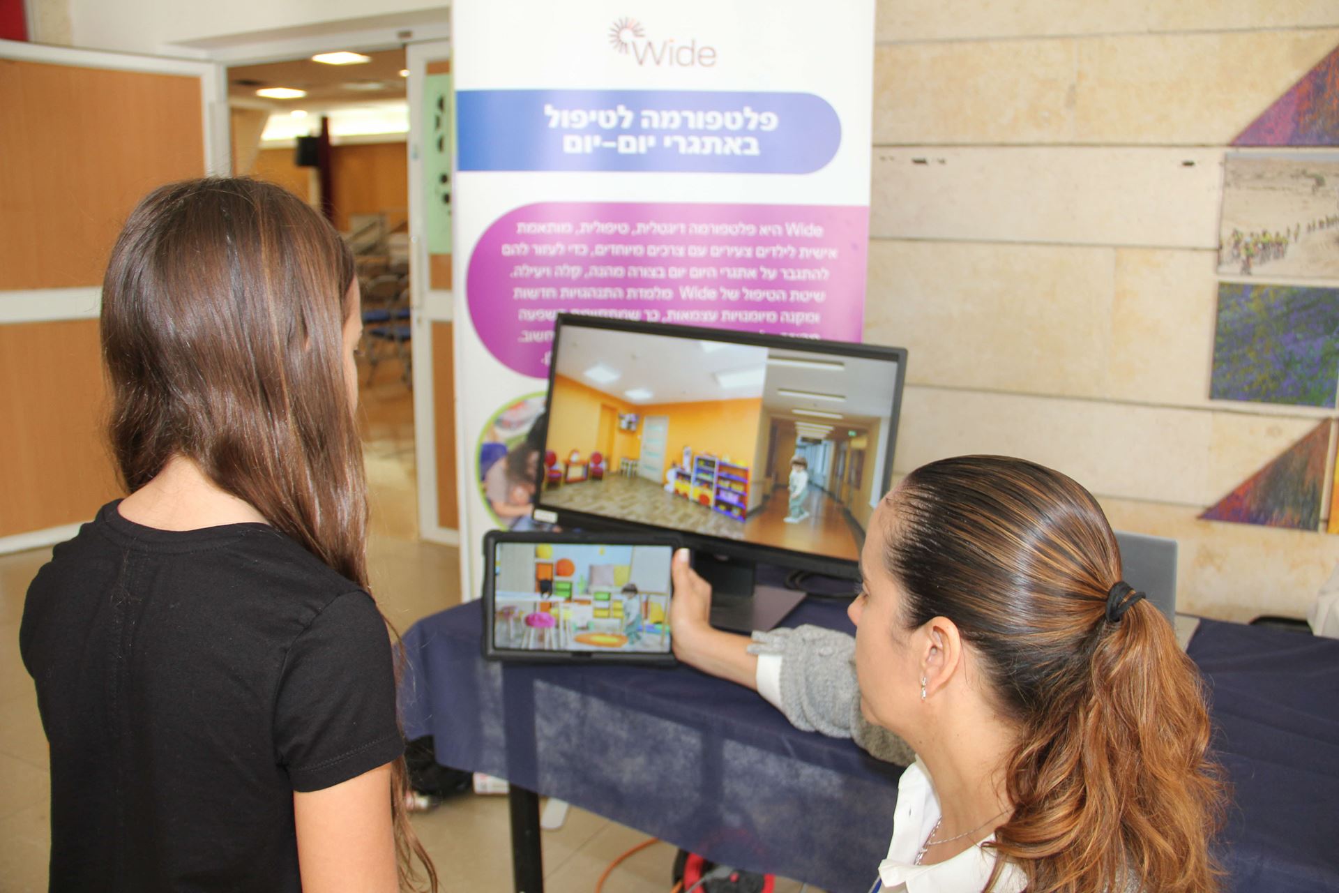 woman displays a game on tablet