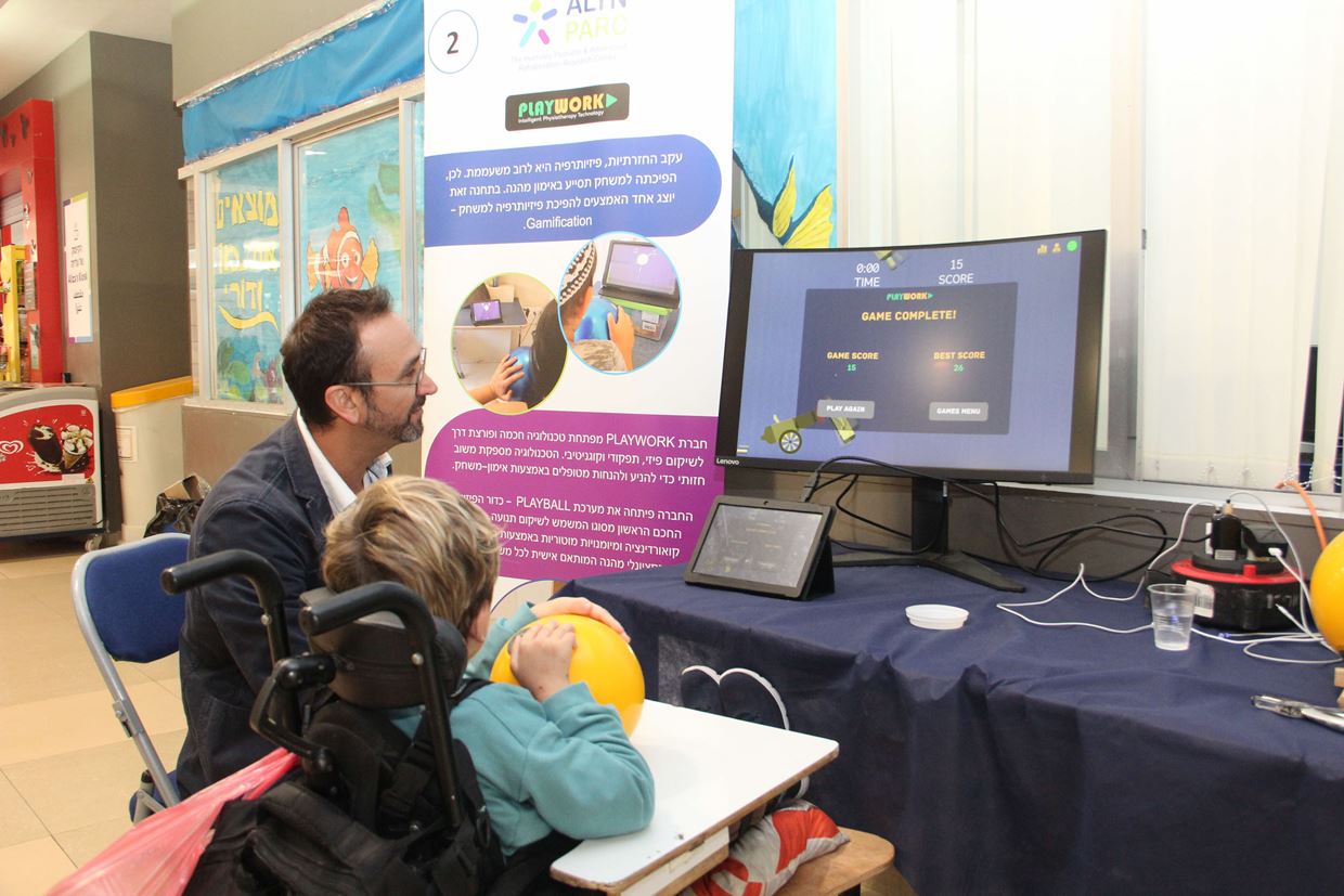 A child with a disability playing on the computer